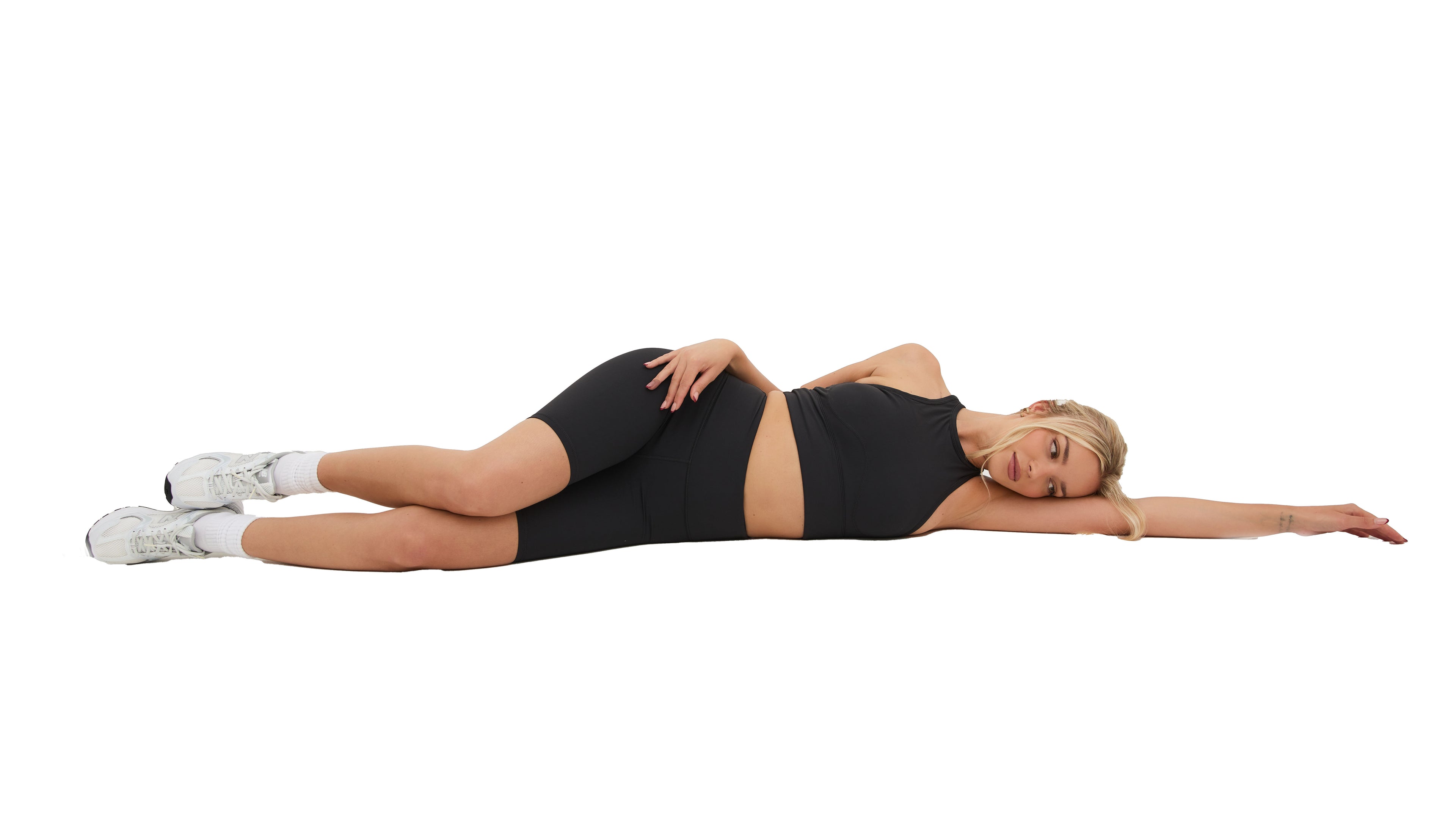 Women wearing GYM2SKIN gymwear, high waisted shorts and sports racer back bra